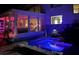 Backyard pool area with a small fountain feature and outdoor lighting for evening enjoyment at 712 Sunset Cv, Madeira Beach, FL 33708