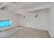 Spacious room featuring white walls, neutral carpet and a window providing natural light at 712 Sunset Cv, Madeira Beach, FL 33708