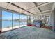 Enclosed sunroom with waterfront views and tile flooring at 712 Sunset Cv, Madeira Beach, FL 33708