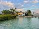 Water view of the home from the water, showcasing its waterfront location and dock access for boating at 712 Sunset Cv, Madeira Beach, FL 33708