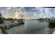 Expansive waterfront view showcasing a private dock and calm water, creating a serene atmosphere at 712 Sunset Cv, Madeira Beach, FL 33708