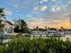 Charming waterfront home featuring a private dock and beautiful sunset views, perfect for relaxing evenings at 712 Sunset Cv, Madeira Beach, FL 33708