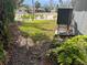A glimpse into the backyard with foliage surrounding at 712 Sunset Cv, Madeira Beach, FL 33708