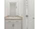 Bathroom features a vanity with granite countertop and white cabinets at 7139 Steer Blade Dr, Zephyrhills, FL 33541