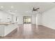 Open concept living area features tile floors and sliding door access to patio at 7139 Steer Blade Dr, Zephyrhills, FL 33541
