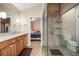 Well-lit bathroom features dual sink vanity, walk-in shower with tile surround, and flows into the main bedroom at 785 5Th S St, Safety Harbor, FL 34695