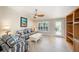 Cozy living room with comfortable seating, tiled floors, a ceiling fan, and plenty of natural light at 785 5Th S St, Safety Harbor, FL 34695