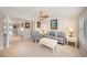 Spacious living room featuring tiled floors, comfortable furnishings, and plenty of natural light at 785 5Th S St, Safety Harbor, FL 34695