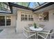 Enclosed patio area featuring a dining table and chairs, perfect for outdoor entertaining at 785 5Th S St, Safety Harbor, FL 34695