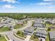 An aerial view of a beautiful home nestled within a tranquil neighborhood with lush landscaping at 8226 Summer Brook Ct, Land O Lakes, FL 34638