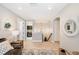 Bright hallway with a staircase, leading to a cozy laundry room and storage area at 8226 Summer Brook Ct, Land O Lakes, FL 34638