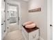 Stylish hallway with a view into a luxurious bathroom, featuring modern decor at 8226 Summer Brook Ct, Land O Lakes, FL 34638