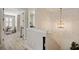 Well-lit upstairs hallway with wood floors, leading to other rooms in the house at 8226 Summer Brook Ct, Land O Lakes, FL 34638