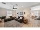 Cozy living room featuring modern furnishings, wood-look floors, and plenty of natural light at 8226 Summer Brook Ct, Land O Lakes, FL 34638