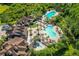 Aerial shot of community pool area featuring multiple pools, lounge chairs and landscaping at 8226 Summer Brook Ct, Land O Lakes, FL 34638