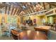 Large recreation room featuring multiple seating areas, pool table, and ample natural light at 8226 Summer Brook Ct, Land O Lakes, FL 34638