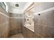 Walk in shower features gray tile with a white tile accent and rain style shower head at 8226 Summer Brook Ct, Land O Lakes, FL 34638