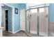 Bright bathroom offering glass enclosed shower and walk-in closet at 8604 Vicksburg Rd, Spring Hill, FL 34608