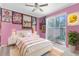 Vibrant bedroom features large sliding doors and a ceiling fan for ultimate comfort and style at 8604 Vicksburg Rd, Spring Hill, FL 34608