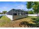 Exterior view of the screened in pool, as seen from the back yard at 8604 Vicksburg Rd, Spring Hill, FL 34608