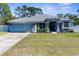 Inviting single-Gathering home with manicured lawn and attractive landscaping at 8604 Vicksburg Rd, Spring Hill, FL 34608
