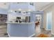 Open kitchen with wrap around breakfast bar, stainless appliances and decorative accents at 8604 Vicksburg Rd, Spring Hill, FL 34608