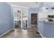 Bright eat-in kitchen with breakfast bar, white cabinetry and sliding glass doors to the lanai at 8604 Vicksburg Rd, Spring Hill, FL 34608
