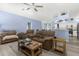 Cozy living room features comfortable seating, light-filled windows and view to the kitchen at 8604 Vicksburg Rd, Spring Hill, FL 34608