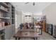 Cozy living room featuring hardwood floors, built-in shelving and natural light at 8604 Vicksburg Rd, Spring Hill, FL 34608