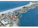 Stunning aerial view of waterfront property near a sandy beach at 9901 1St E St # D, Treasure Island, FL 33706