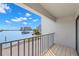Balcony overlooking the waterfront featuring aluminum railings and gorgeous waterfront views at 9901 1St E St # D, Treasure Island, FL 33706