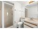 Full bathroom featuring a glass-enclosed shower, sink, and vanity with ample storage space at 9901 1St E St # D, Treasure Island, FL 33706