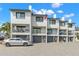 Stylish townhome with private balconies, garage parking, and contemporary design provides comfortable living at 9901 1St E St # D, Treasure Island, FL 33706