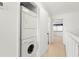 Convenient laundry area featuring stacked washer and dryer, maximizing space in the home at 9901 1St E St # D, Treasure Island, FL 33706