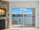 Living room with a sliding glass door to a balcony that provides beautiful views of the intercoastal waterway at 9901 1St E St # D, Treasure Island, FL 33706