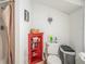 Functional bathroom featuring a toilet, shower, cabinet, and minimalist decor at 11101 Corlett Rd, Riverview, FL 33578