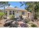 Quaint home with mature landscaping and a brick walkway at 11101 Corlett Rd, Riverview, FL 33578