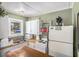 Functional kitchen with white cabinets, classic appliances, and a charming window above the sink at 11101 Corlett Rd, Riverview, FL 33578