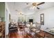 Spacious and airy living room with hardwood floors, comfortable seating, and a dining area at 11101 Corlett Rd, Riverview, FL 33578