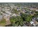 Extensive aerial view showcasing a residential community with lakes, waterways, and tree-lined streets at 10137 Oleander Dr, Port Richey, FL 34668