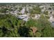 Aerial shot showcasing a peaceful community with tree-lined streets and well-maintained homes at 10137 Oleander Dr, Port Richey, FL 34668
