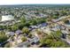 Wide aerial shot of a neighborhood with homes, waterways, mature trees, and lush landscaping at 10137 Oleander Dr, Port Richey, FL 34668