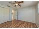 Cozy bedroom with closet and wood floors at 10137 Oleander Dr, Port Richey, FL 34668