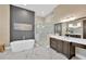 Stunning bathroom featuring a soaking tub, glass shower and elegant marble flooring at 10509 Broadland Pass, Thonotosassa, FL 33592