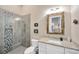 Charming bathroom featuring a tiled glass shower, and granite vanity at 10509 Broadland Pass, Thonotosassa, FL 33592