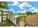 Scenic dock and walkway, perfect for enjoying waterfront views on a sunny day at 10509 Broadland Pass, Thonotosassa, FL 33592