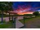 Scenic view of a private dock at sunset offering a serene waterfront experience at 10509 Broadland Pass, Thonotosassa, FL 33592