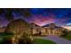 Elegant home exterior featuring a well-manicured front yard and picturesque sunset backdrop at 10509 Broadland Pass, Thonotosassa, FL 33592