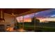 Inviting screened-in lanai with an outdoor kitchen and comfortable seating for relaxation at 10509 Broadland Pass, Thonotosassa, FL 33592