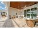Covered patio with seating area and view of the backyard at 10509 Broadland Pass, Thonotosassa, FL 33592